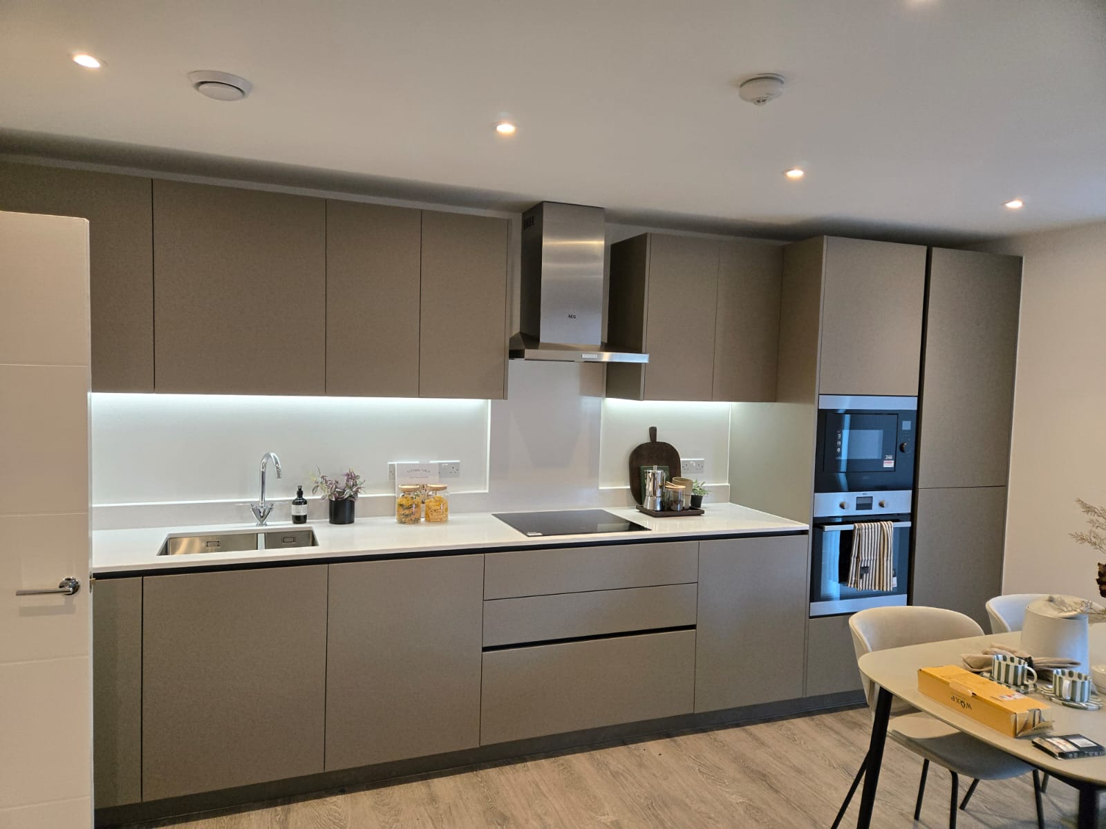 Staged living area in a newly built apartment after furniture installation and final room setup.