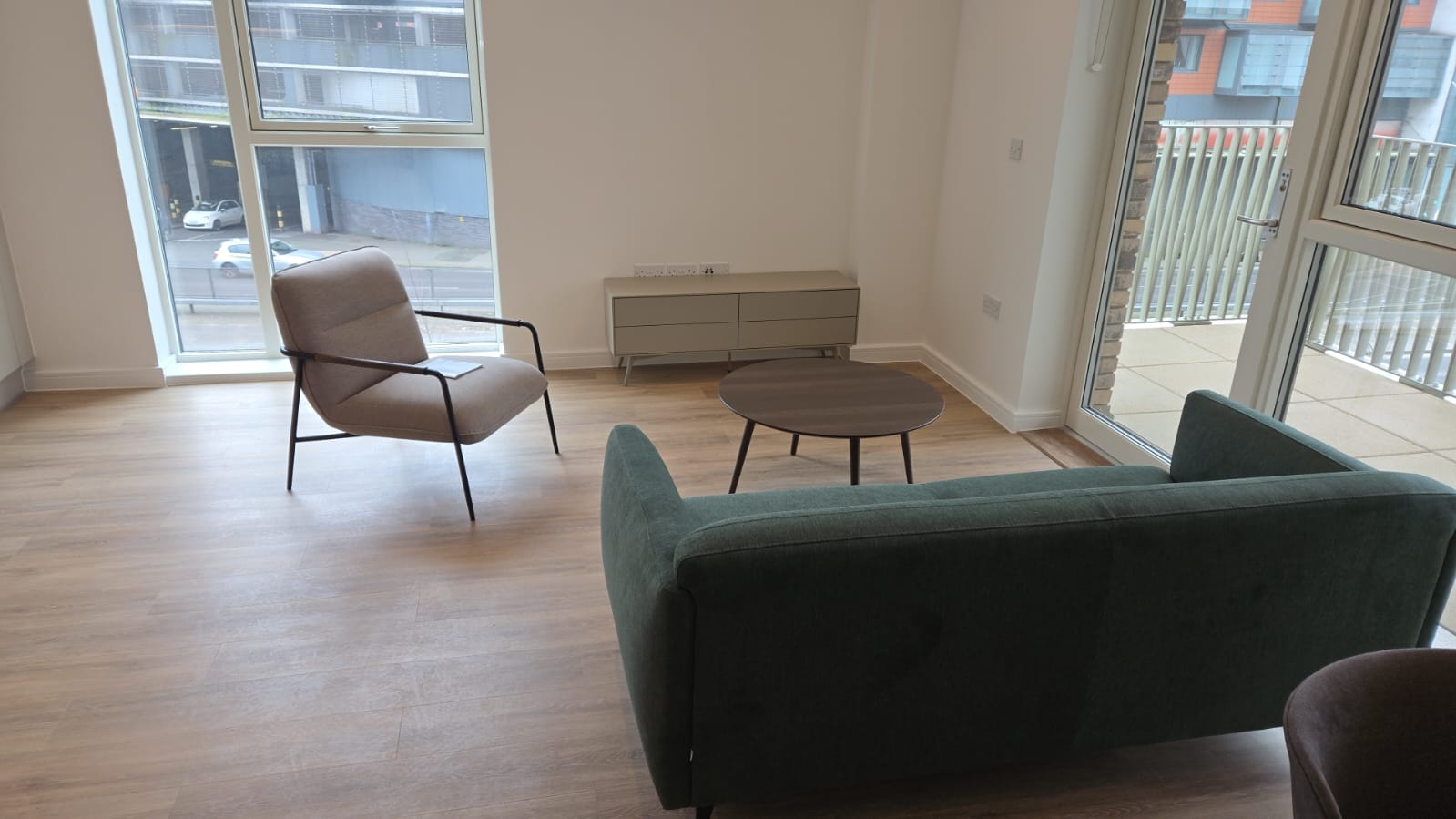 Completed bedroom installation with bed frame and mattress fitted in a new-build apartment.